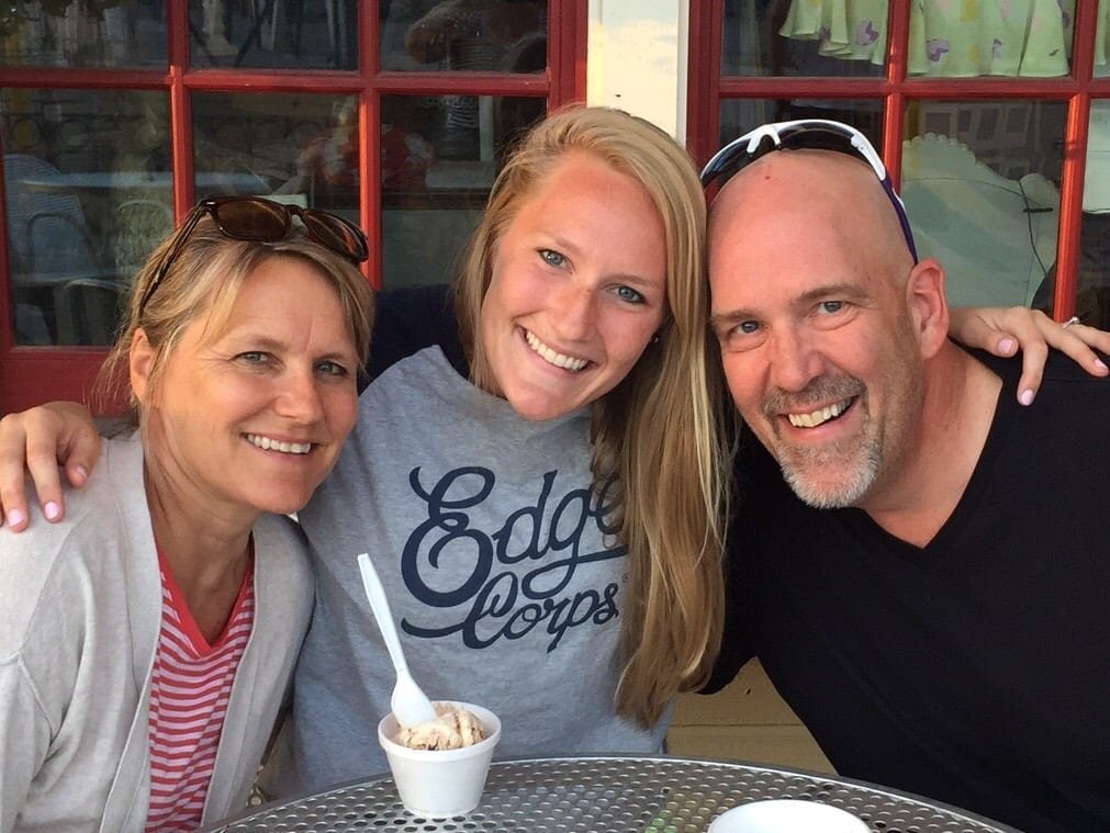 Family smiling together eating ice cream